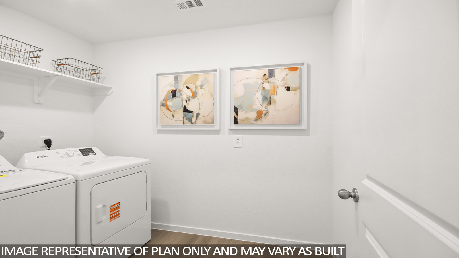 utiliity room with vinyl flooring