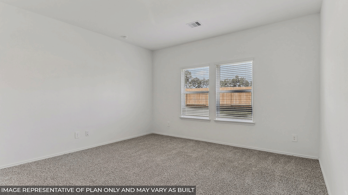Primary bedroom with bright windows