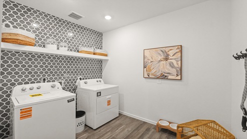 utility room with vinyl flooring