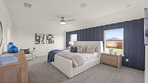 primary bedroom with carpet flooring