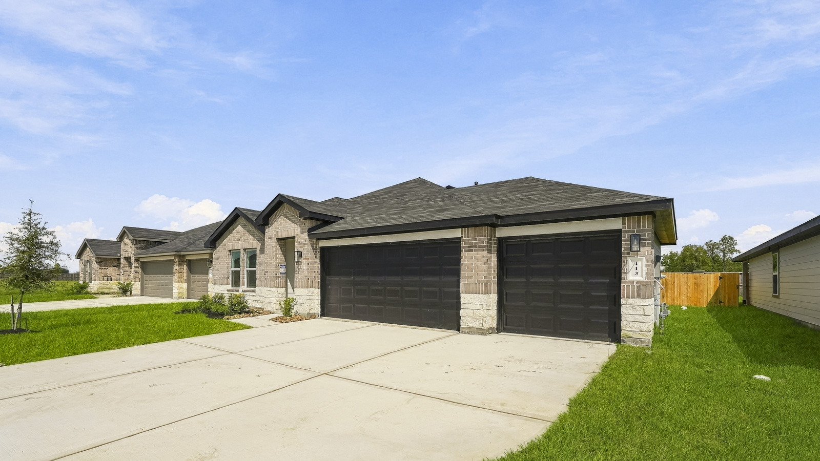 one story home with three car garage