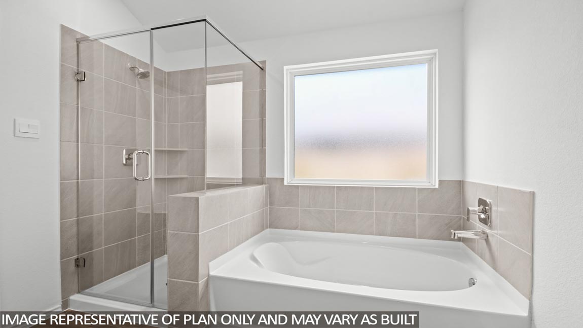 Primary bathroom with tub and shower