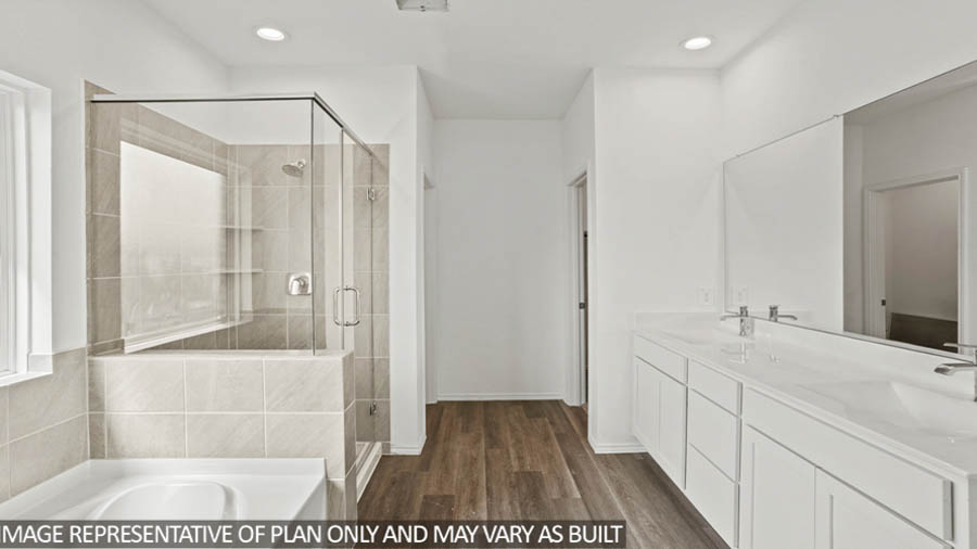 Primary bathroom with tub and shower