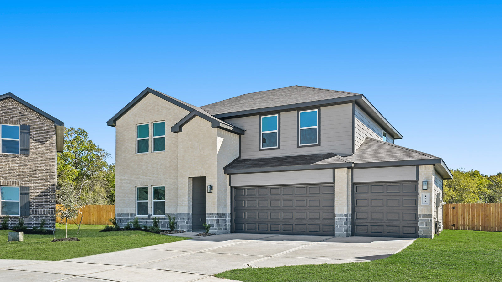 two story home with 3 car garage