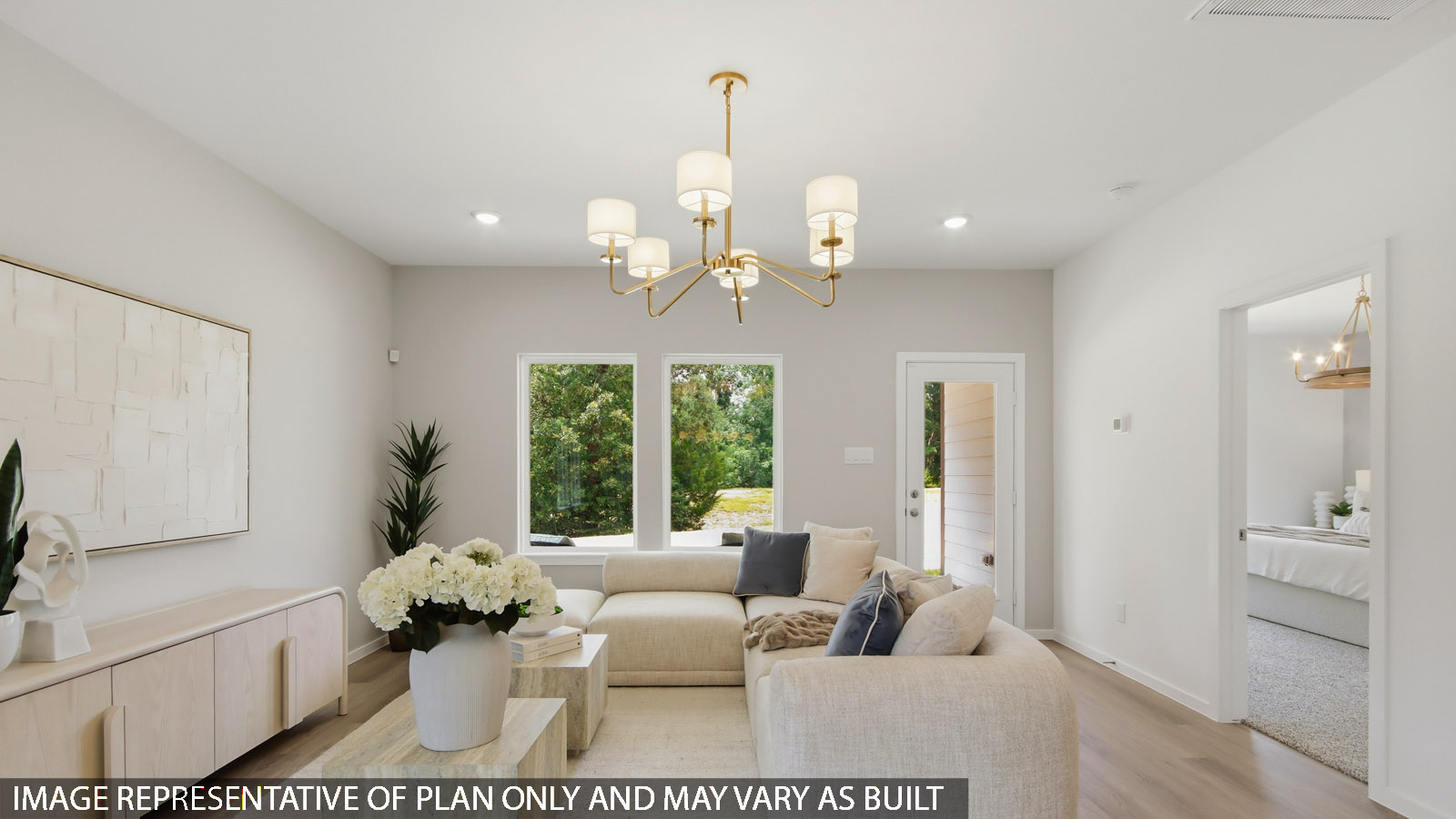 Spacious living area with vinyl flooring