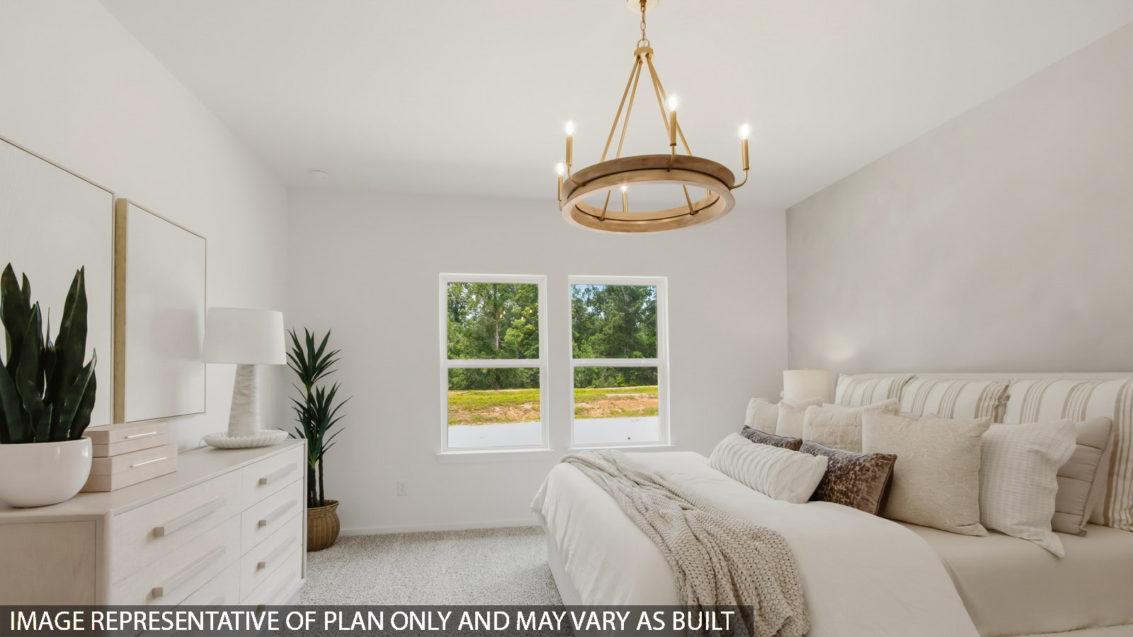 Primary bedroom with bright windows