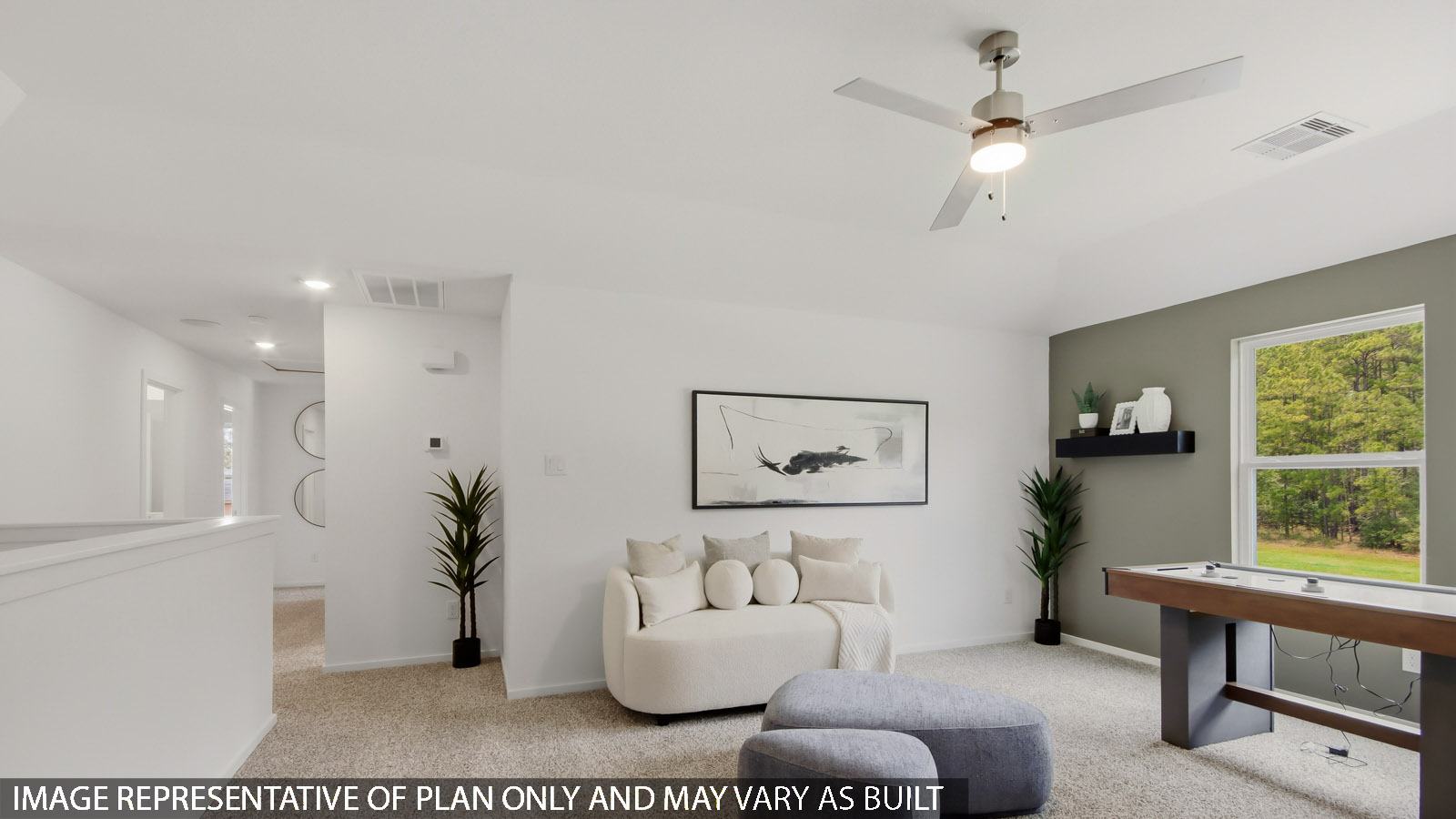 Second story game room with carpet flooring