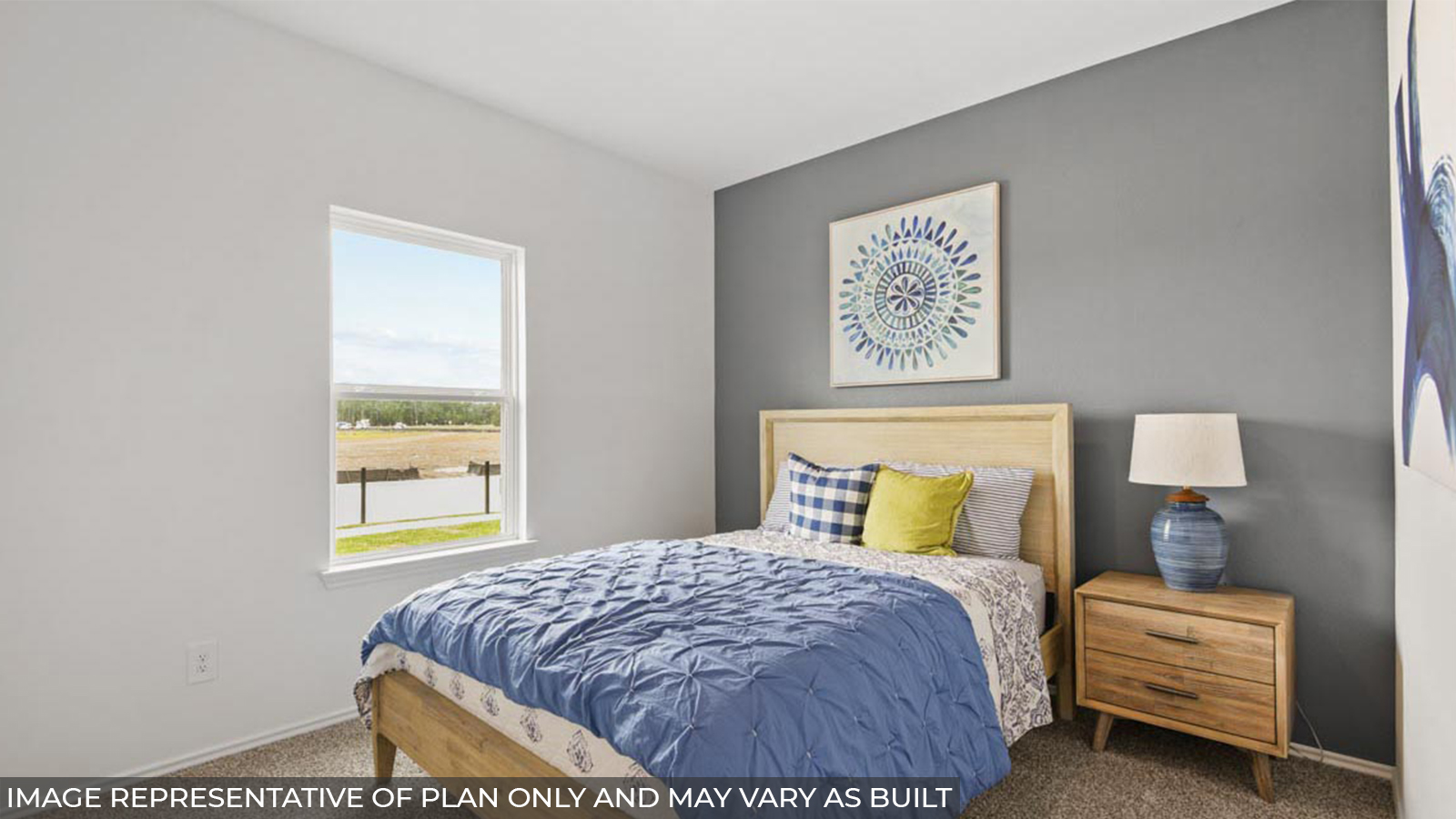 Secondary bedroom with carpet flooring