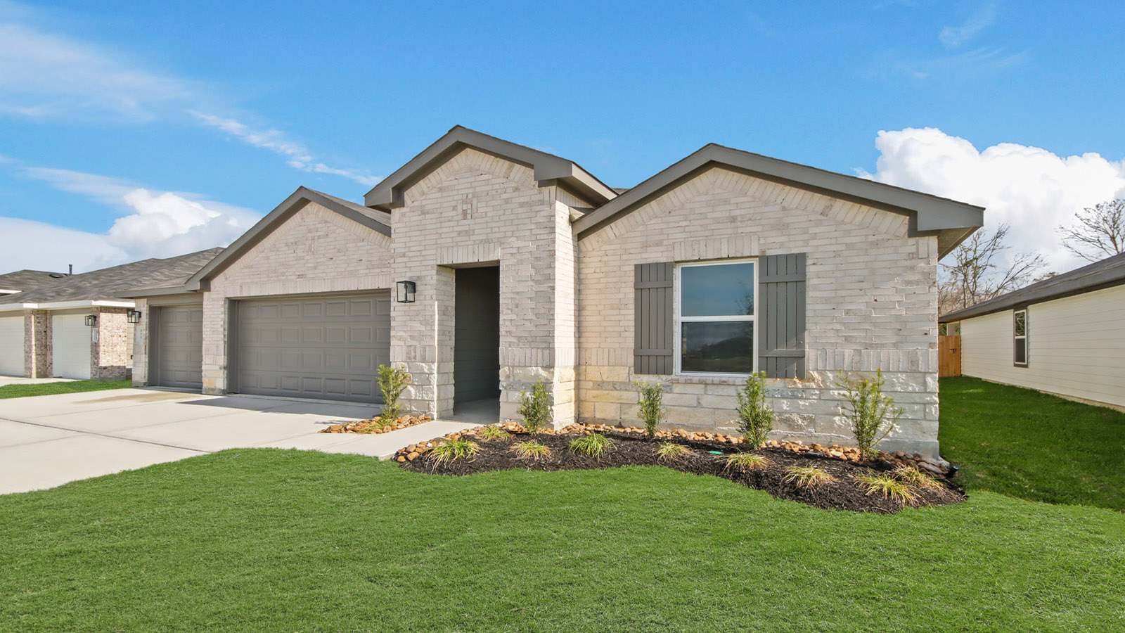 one story home with a  3 car garage