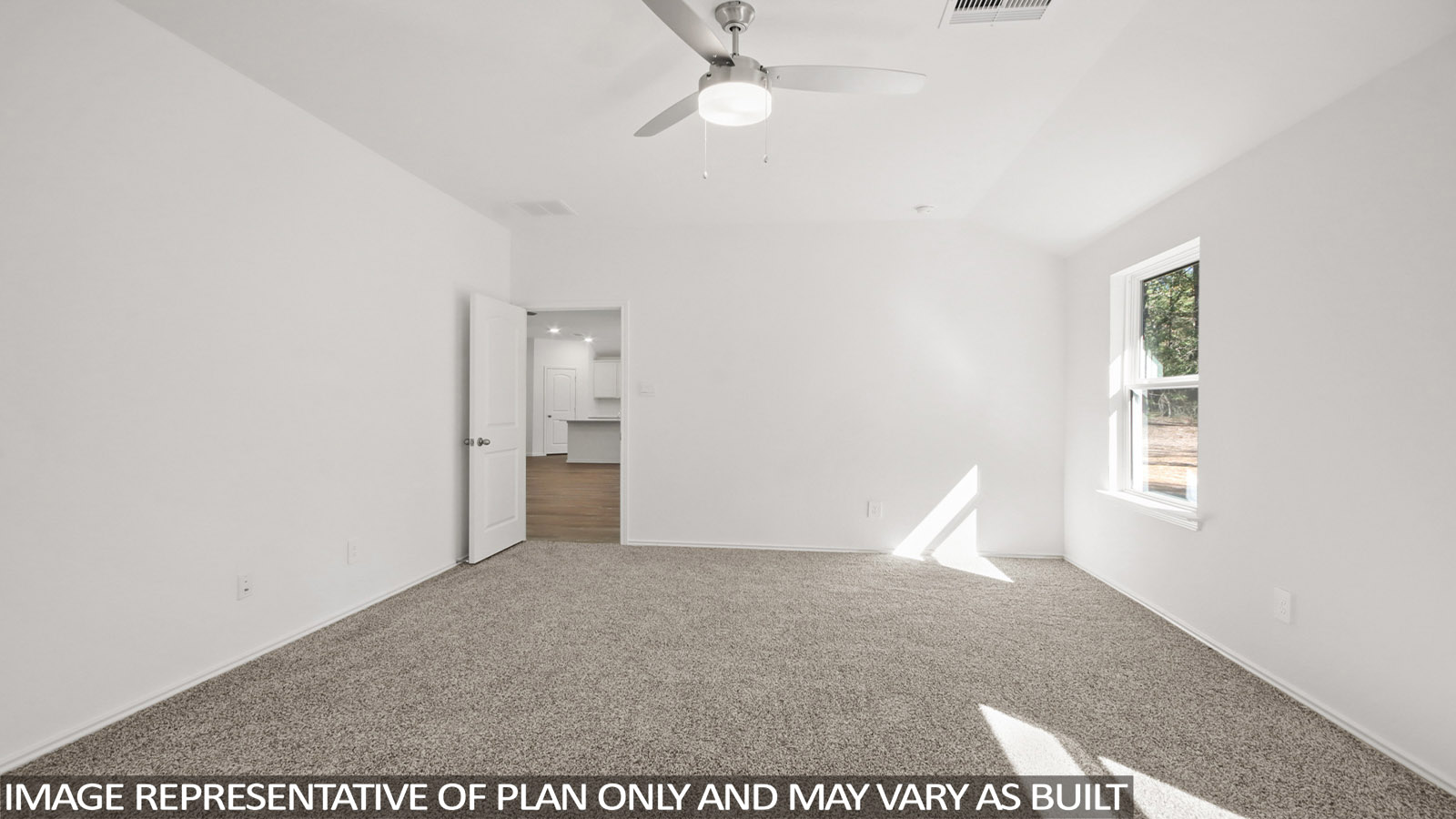 Primary bedroom with carpet flooring