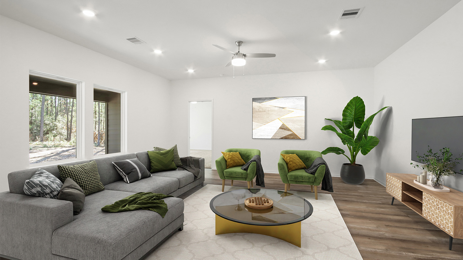 Spacious living area with vinyl flooring