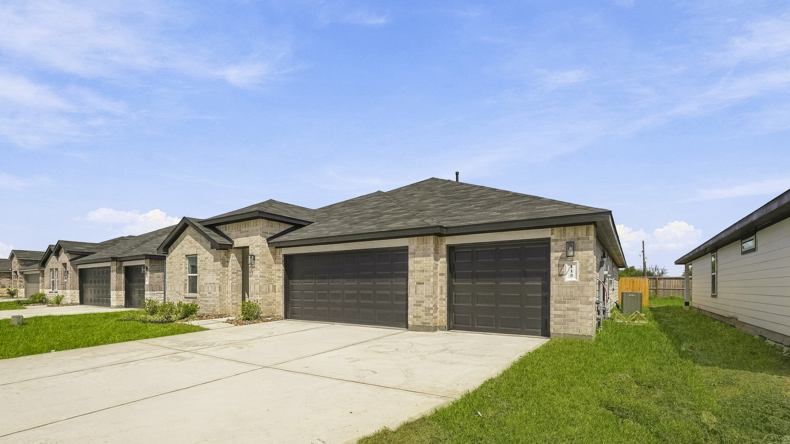 one story home with three car garage