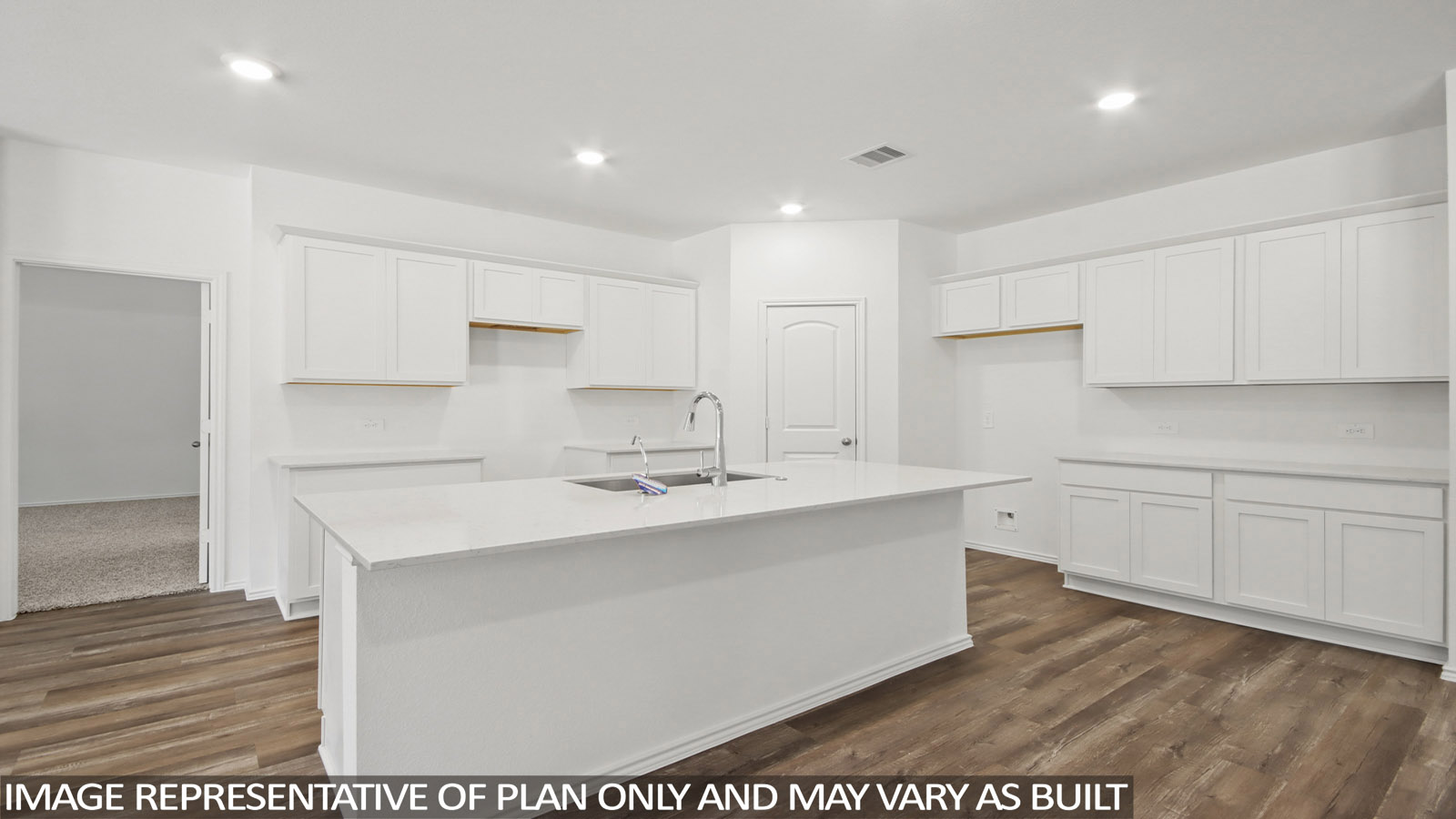 Kitchen with an island and vinyl floor