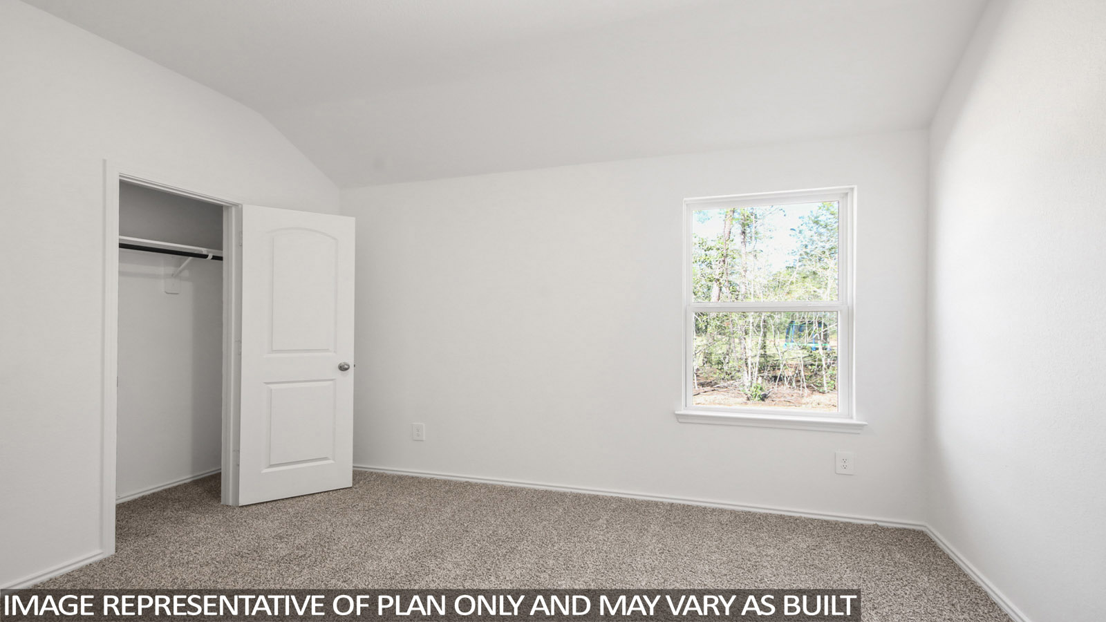 Secondary bedroom with carpet flooring