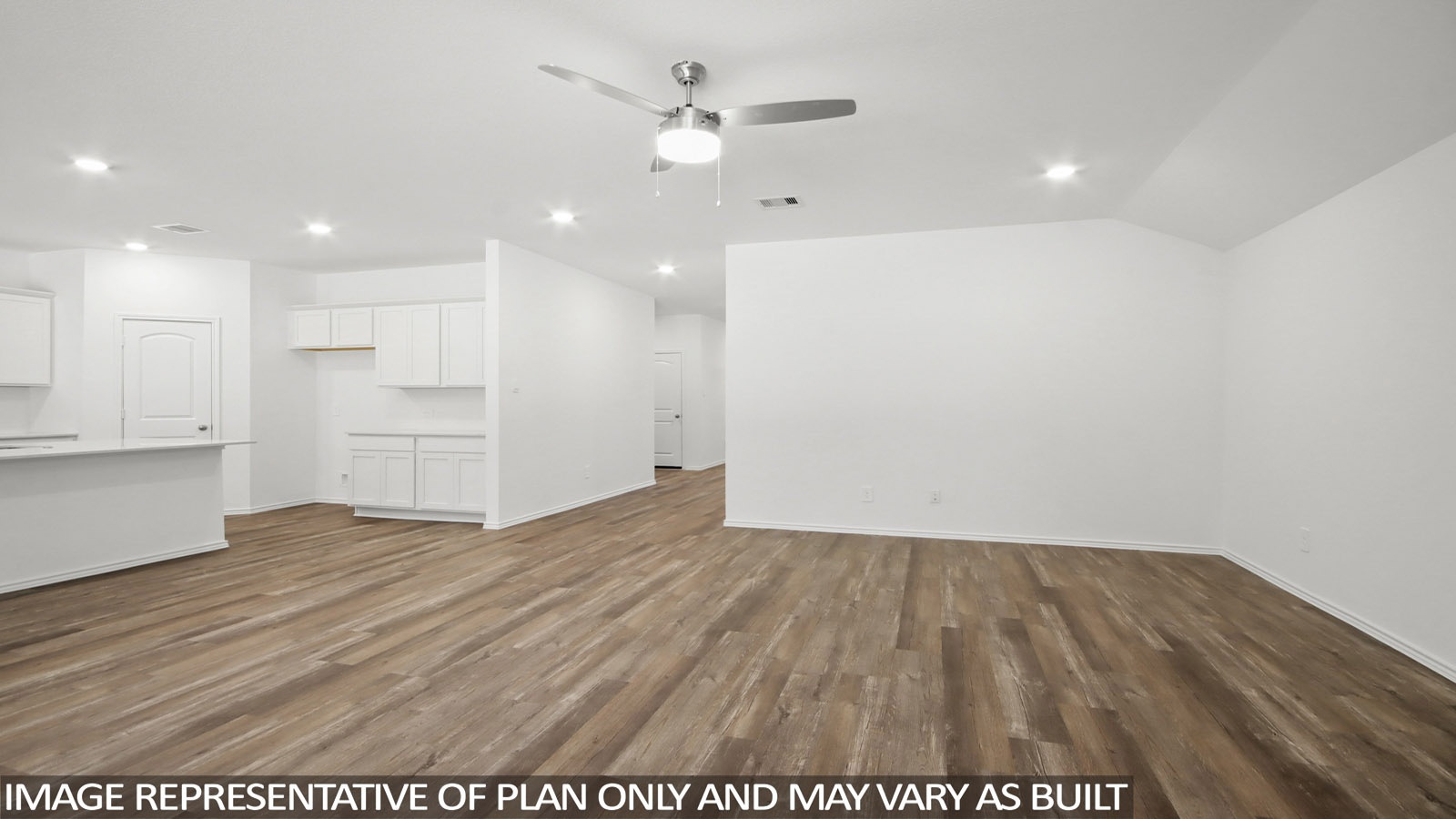 Spacious living room with view into dining and kitchen areas, and outside access at Medina