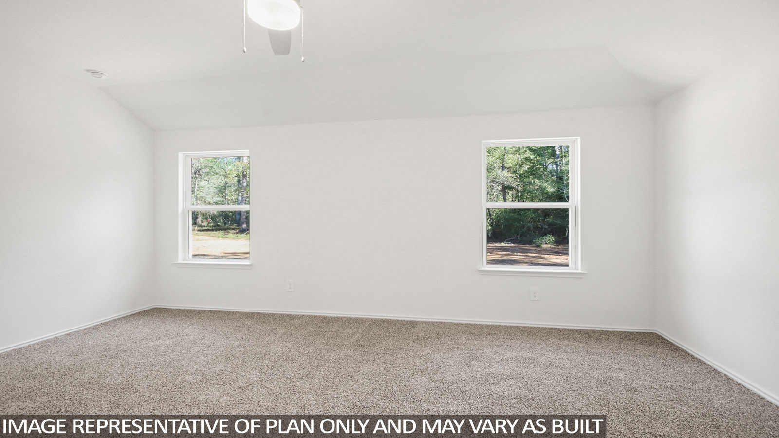 Primary bedroom with carpet flooring