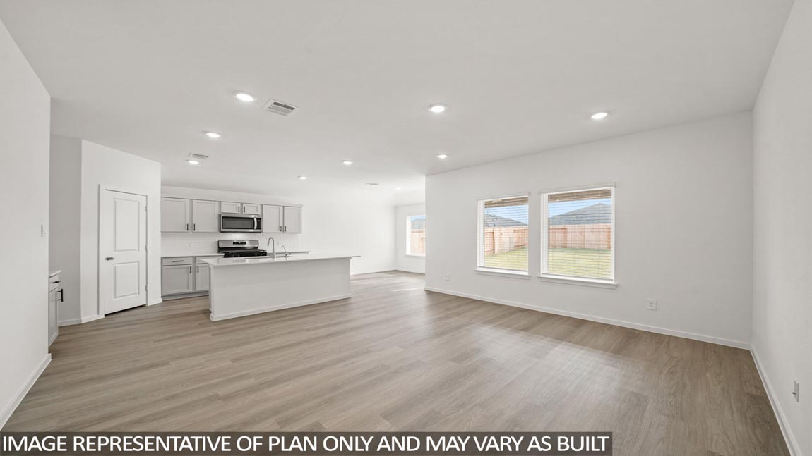 Kitchen with an island and vinyl floor