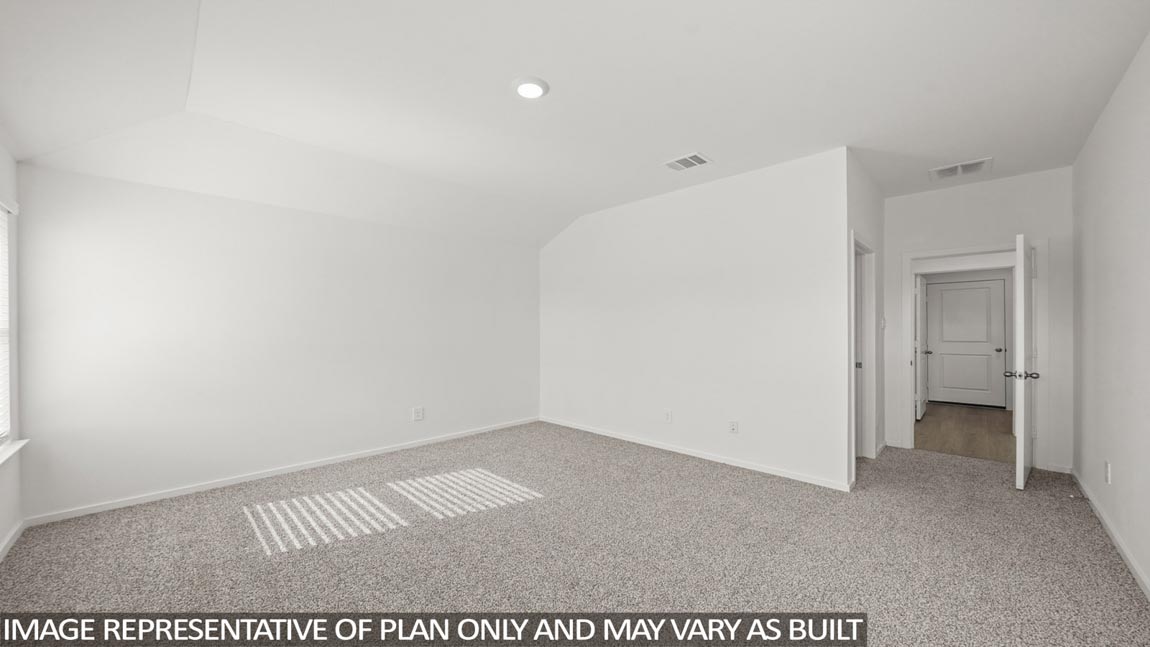 Primary bedroom with carpet flooring