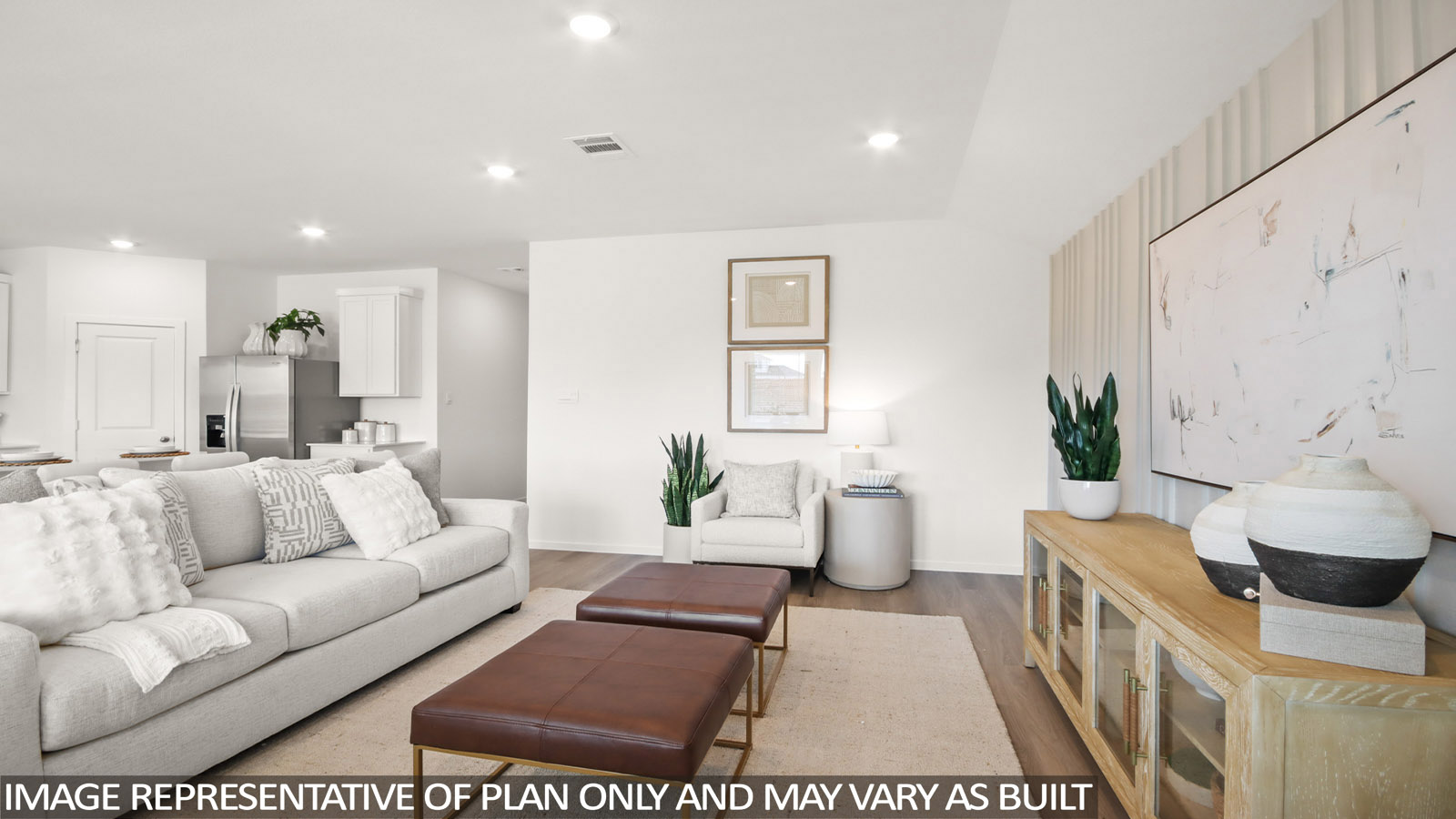 Spacious living area with vinyl flooring