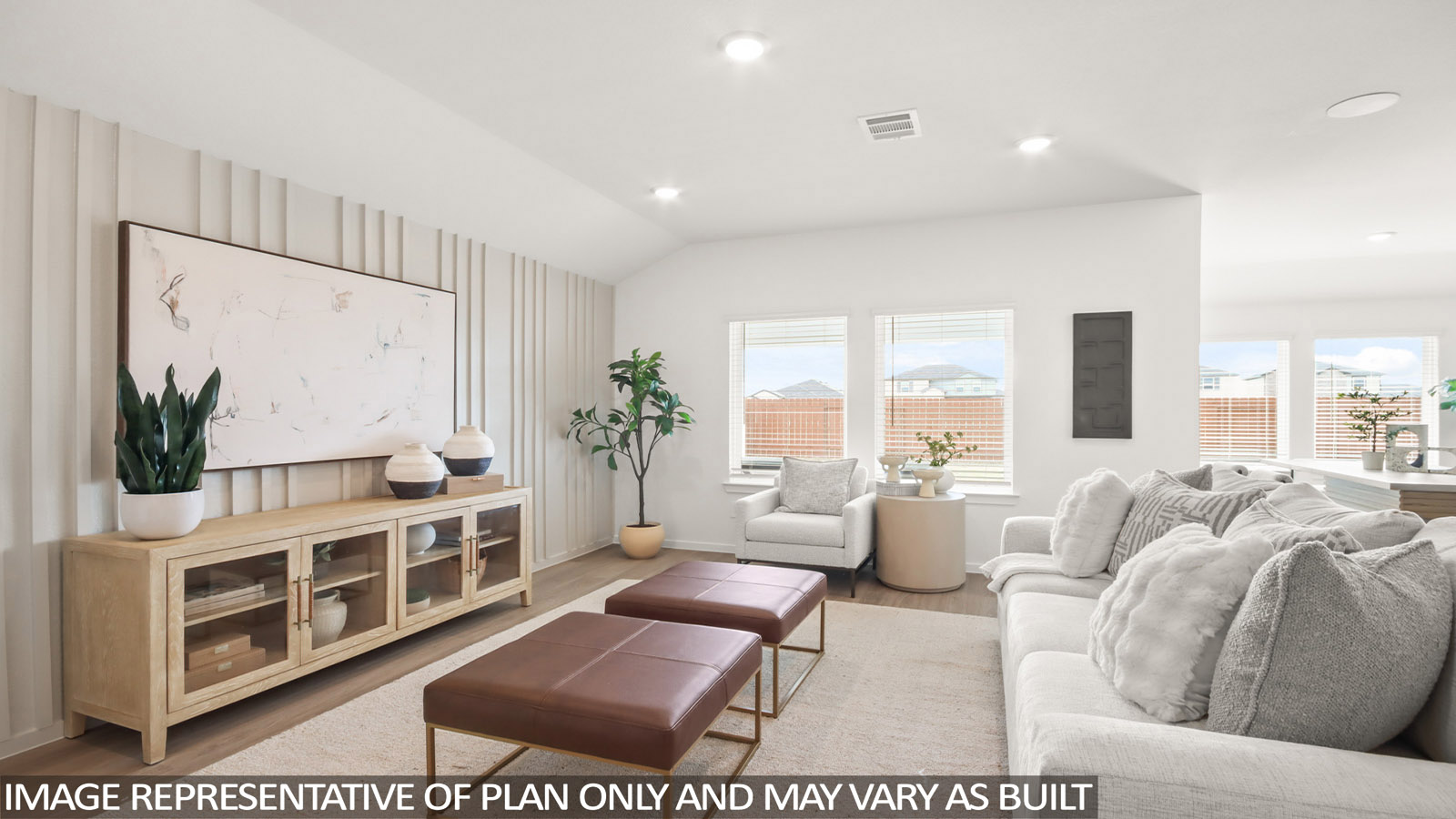 Spacious living area with vinyl flooring