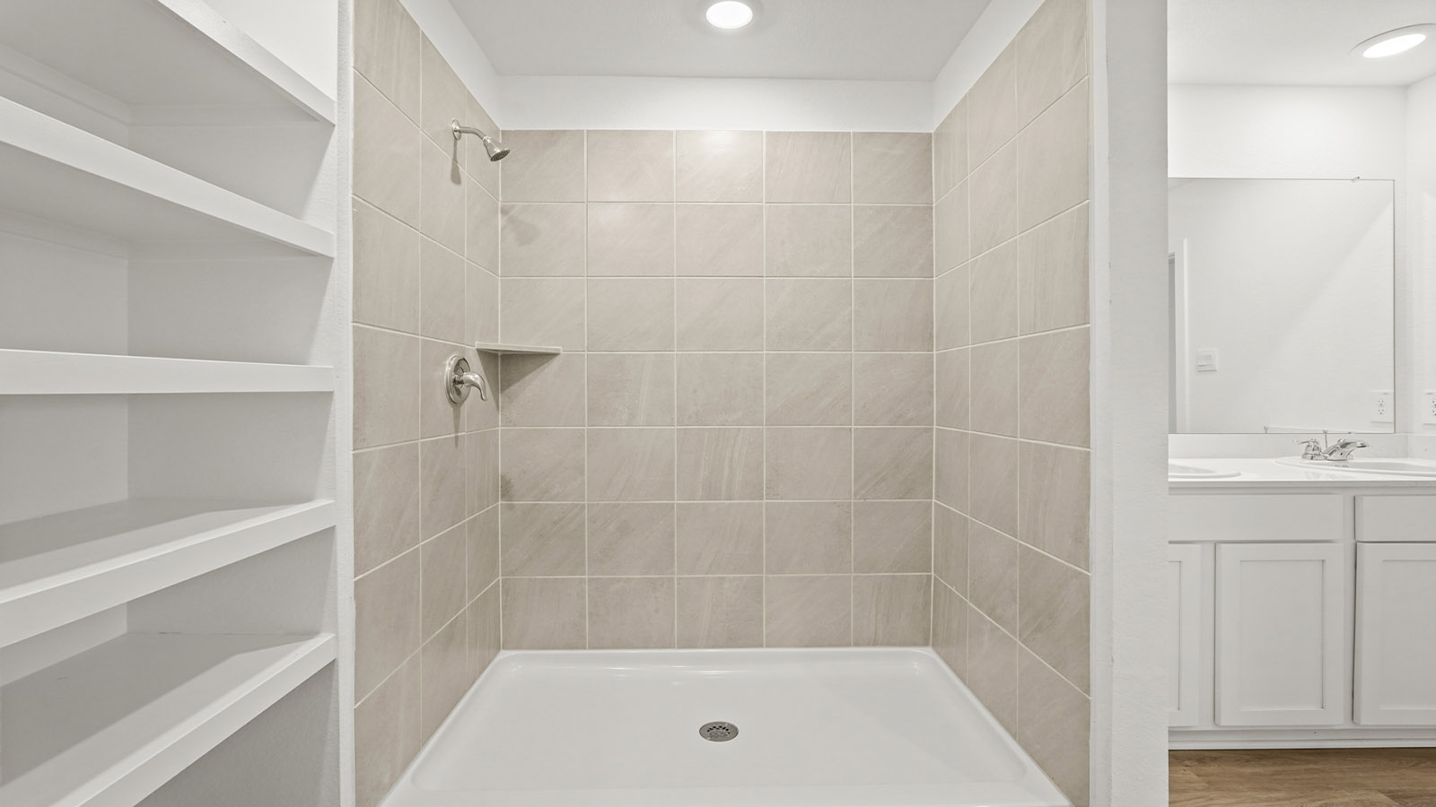 Primary bathroom with shower and linen storage