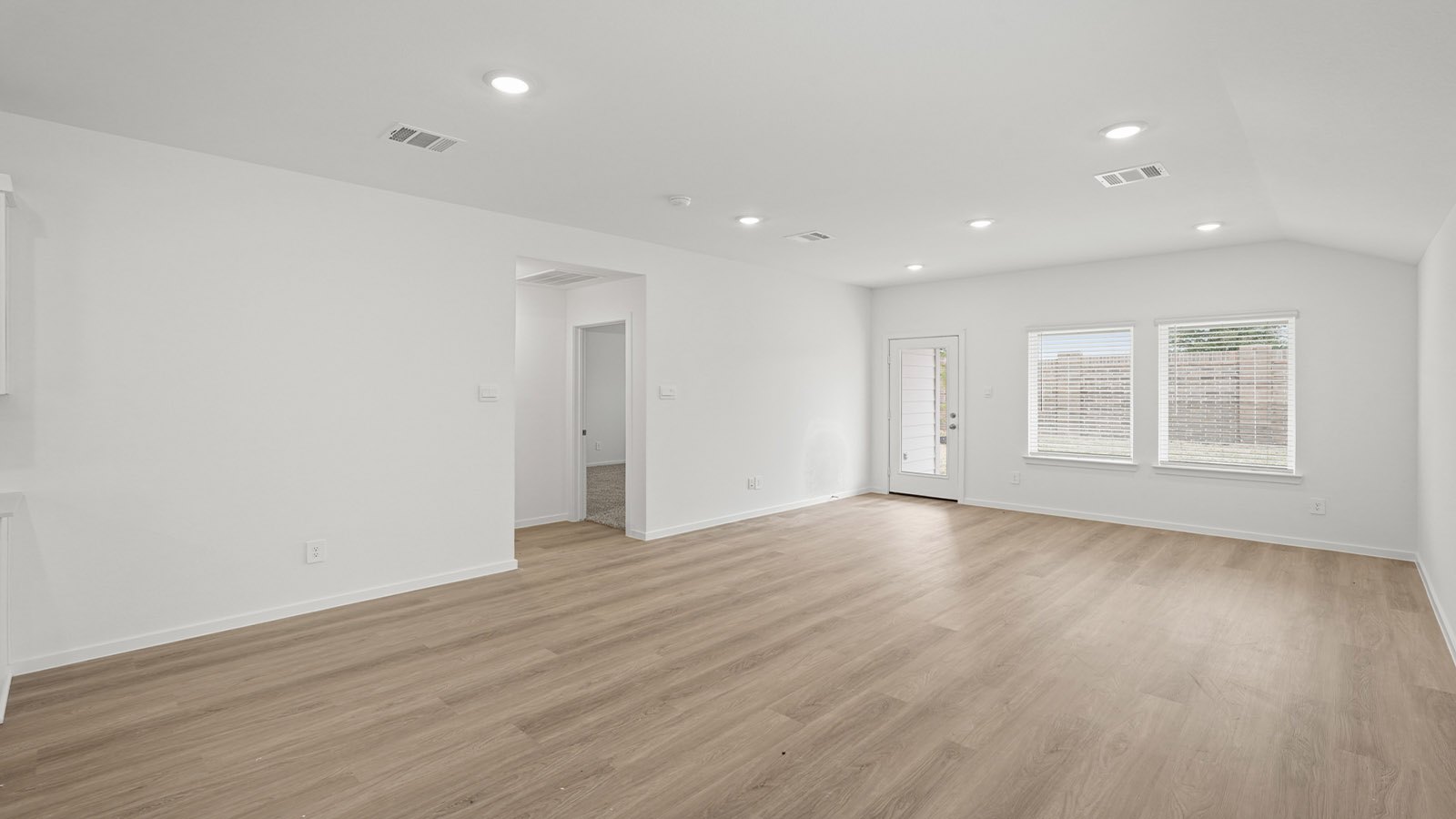 Open concept living, dining, and kitchen area