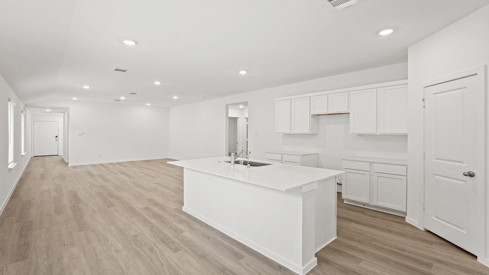 Open concept living, dining, and kitchen area