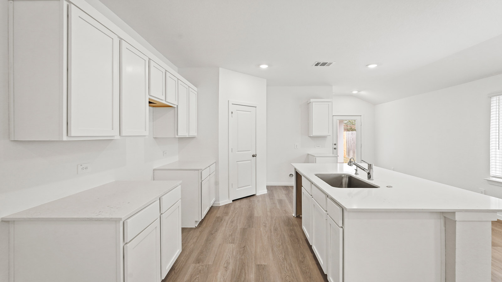 Open concept living, dining, and kitchen area