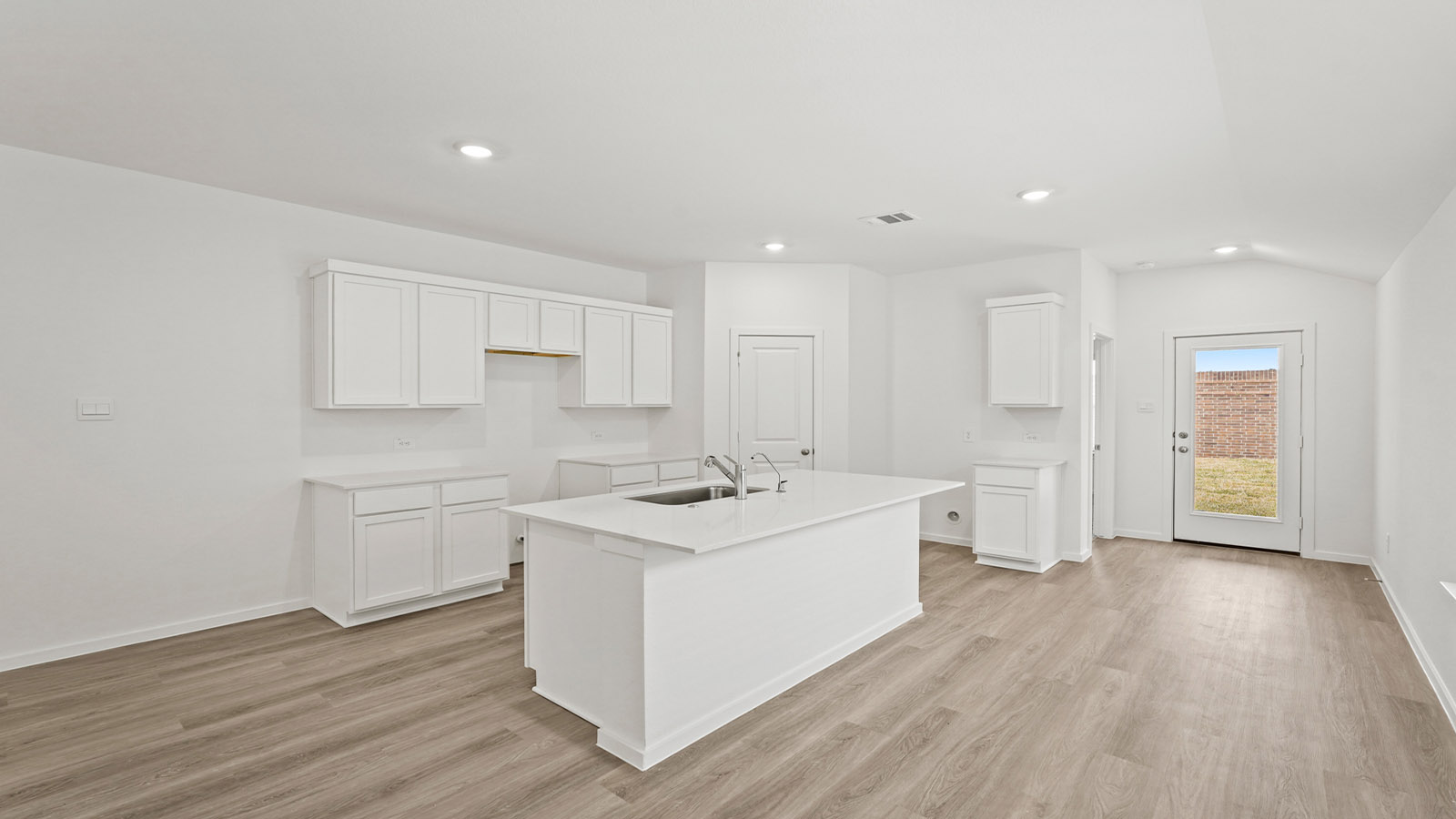 Open concept living, dining, and kitchen area