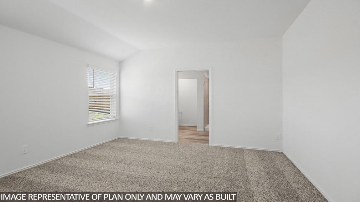 Primary bedroom with bright windows