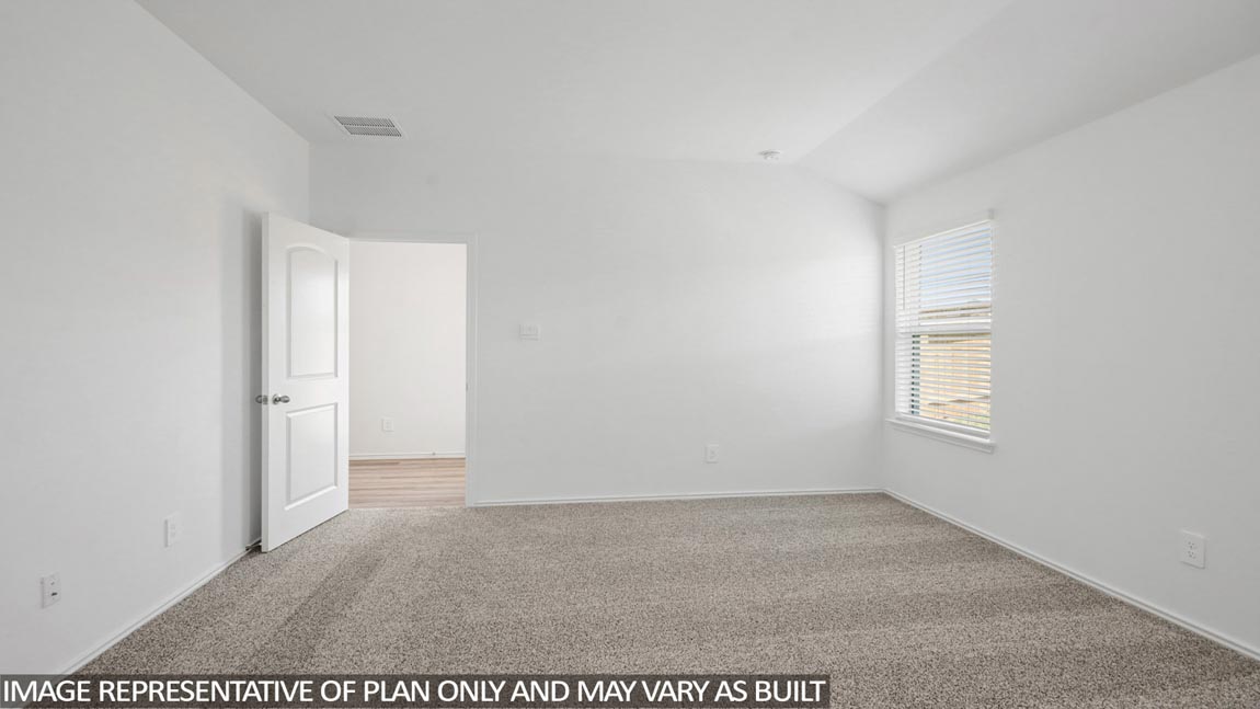 Primary bedroom with bright windows