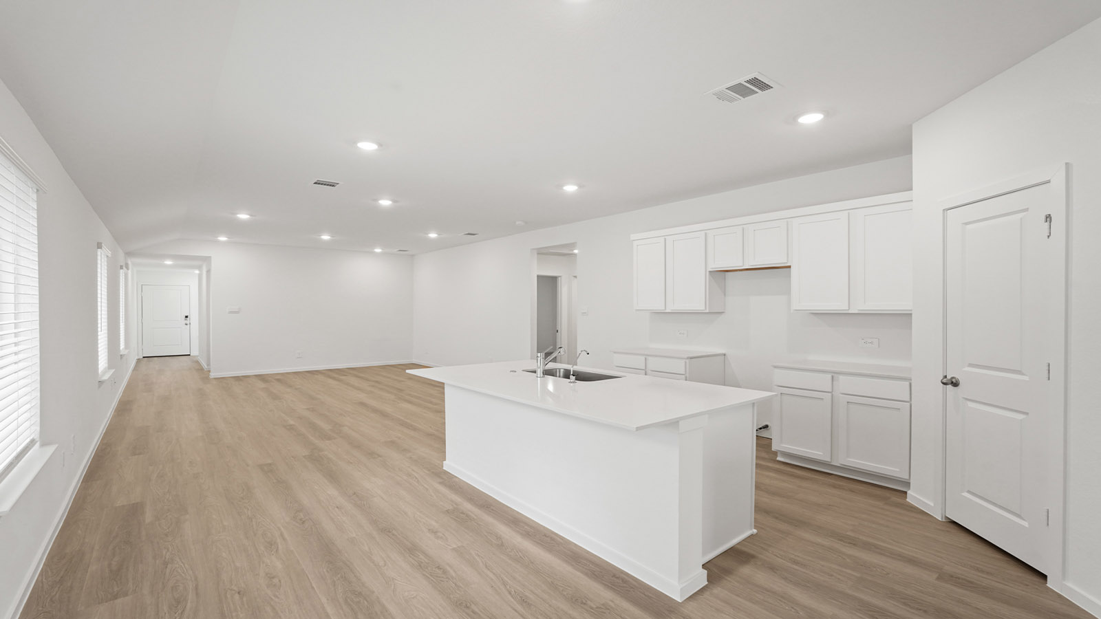 Open concept living, dining, and kitchen area