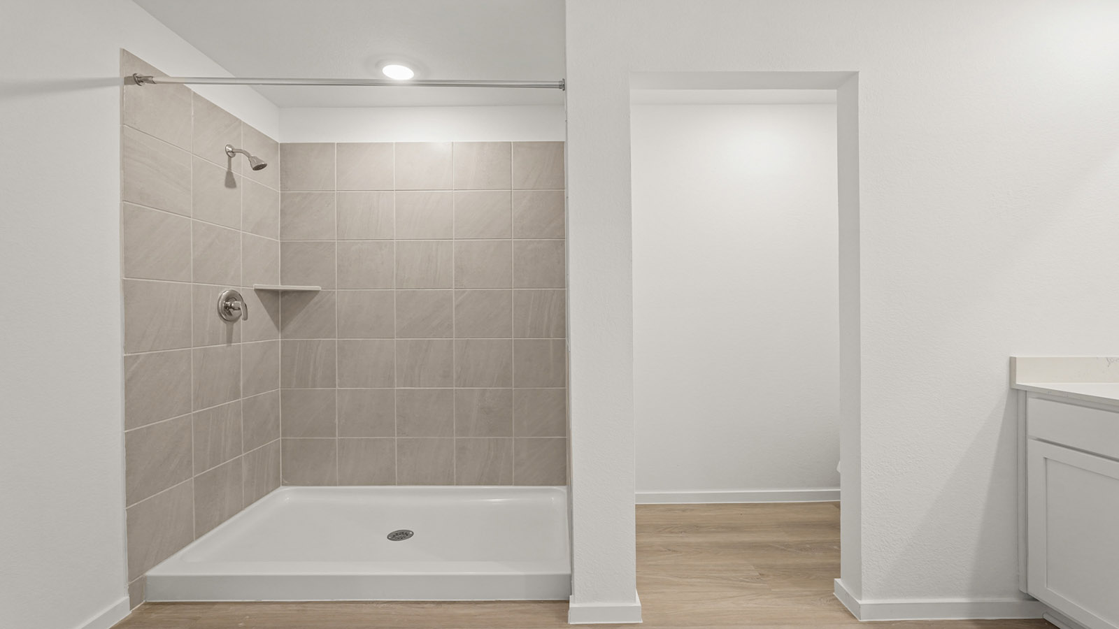 Primary bathroom with shower and linen storage