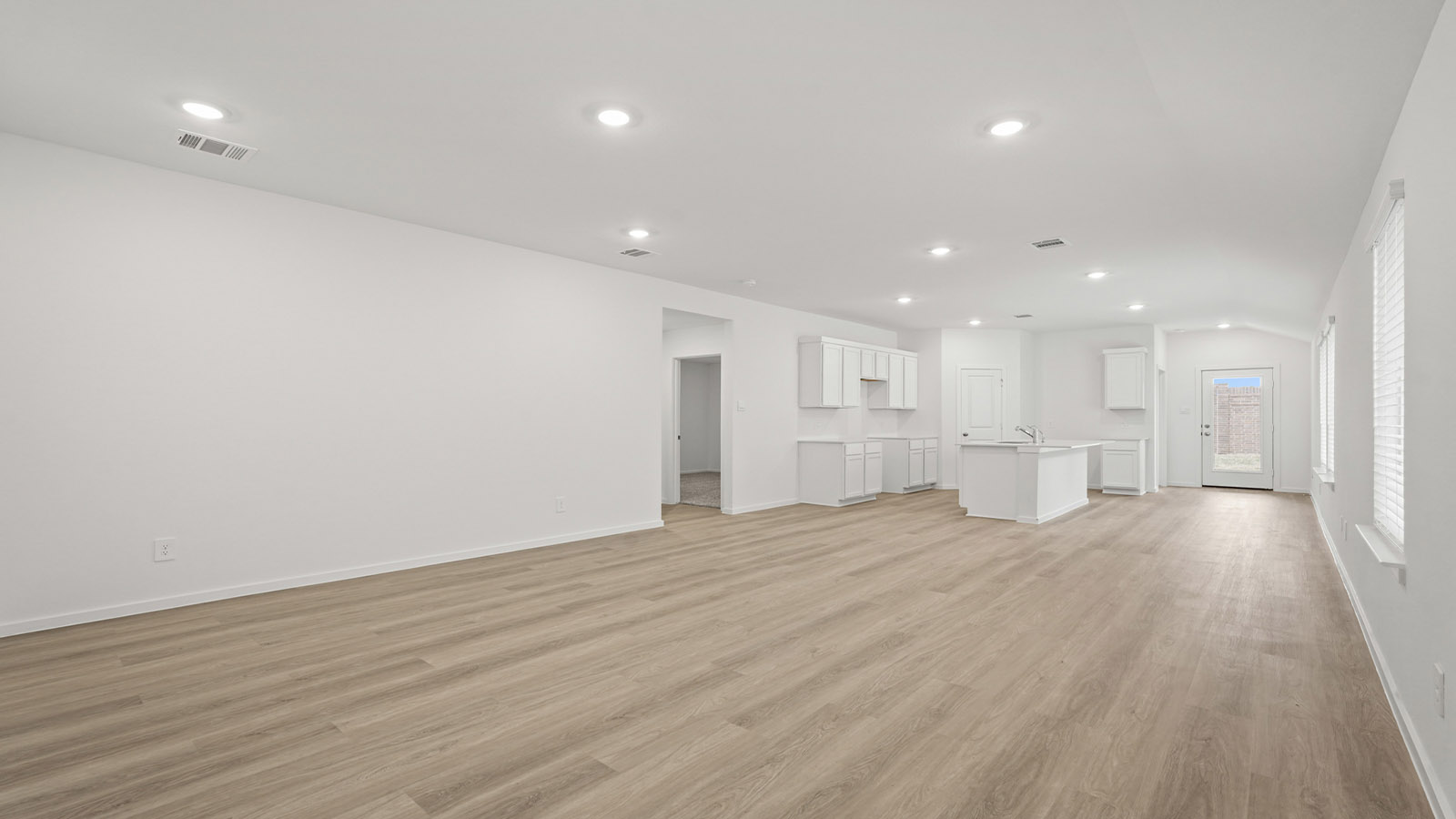 Open concept living, dining, and kitchen area