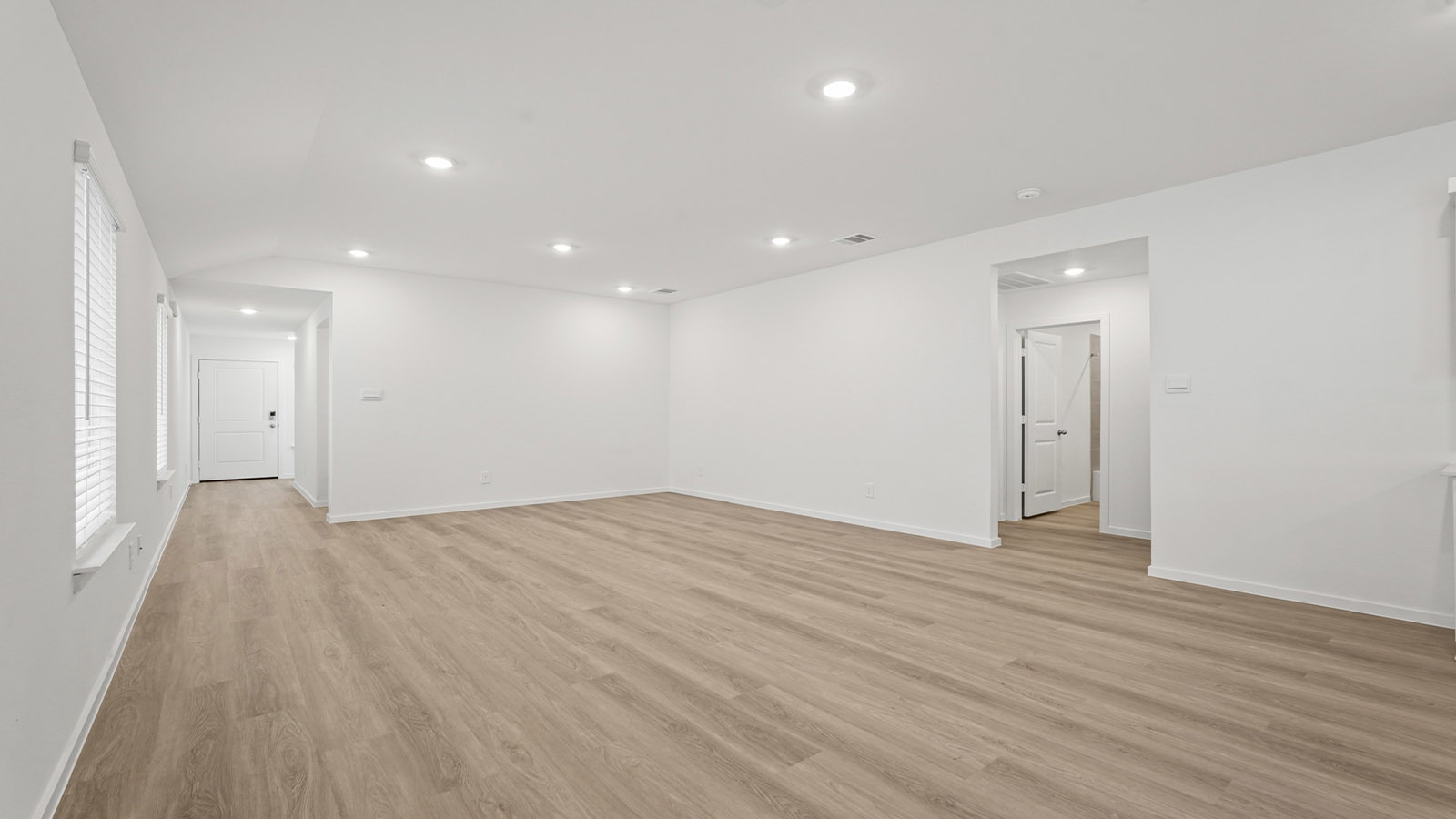 Open concept living, dining, and kitchen area