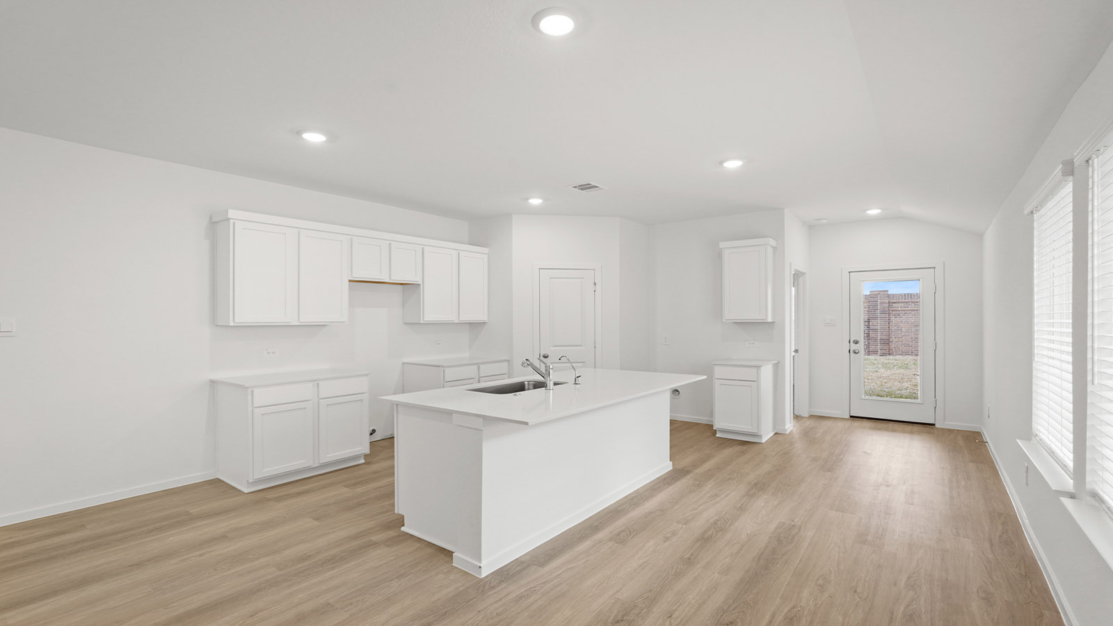 Open concept living, dining, and kitchen area