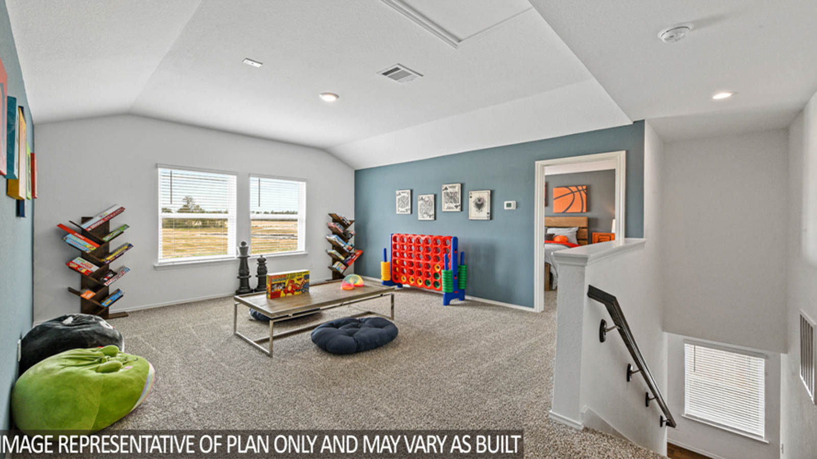 Second story game room with carpet flooring