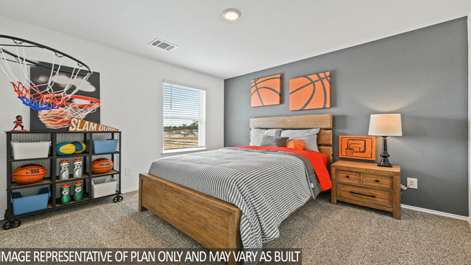Secondary bedroom with carpet flooring