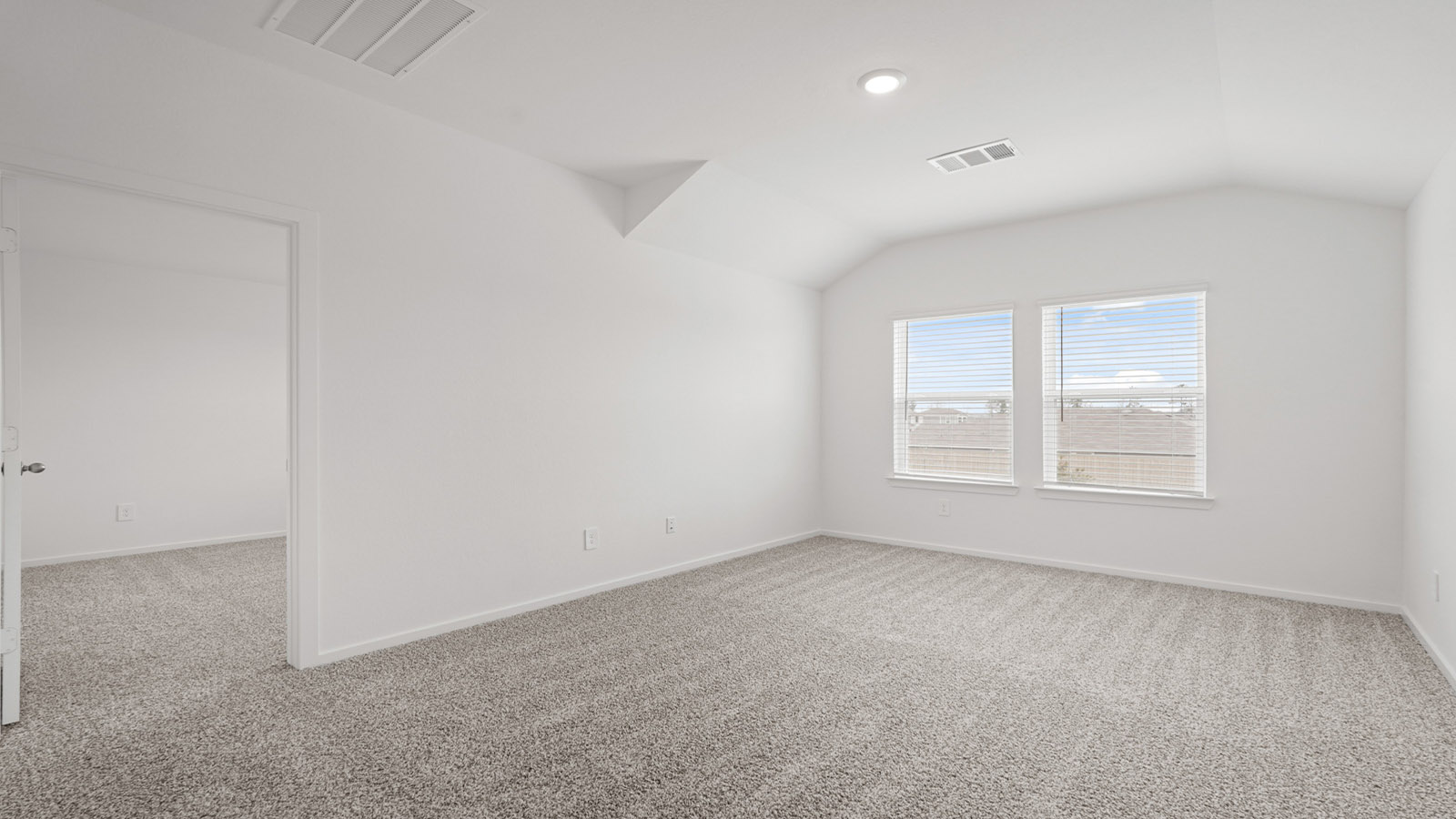 Second story game room with carpet flooring