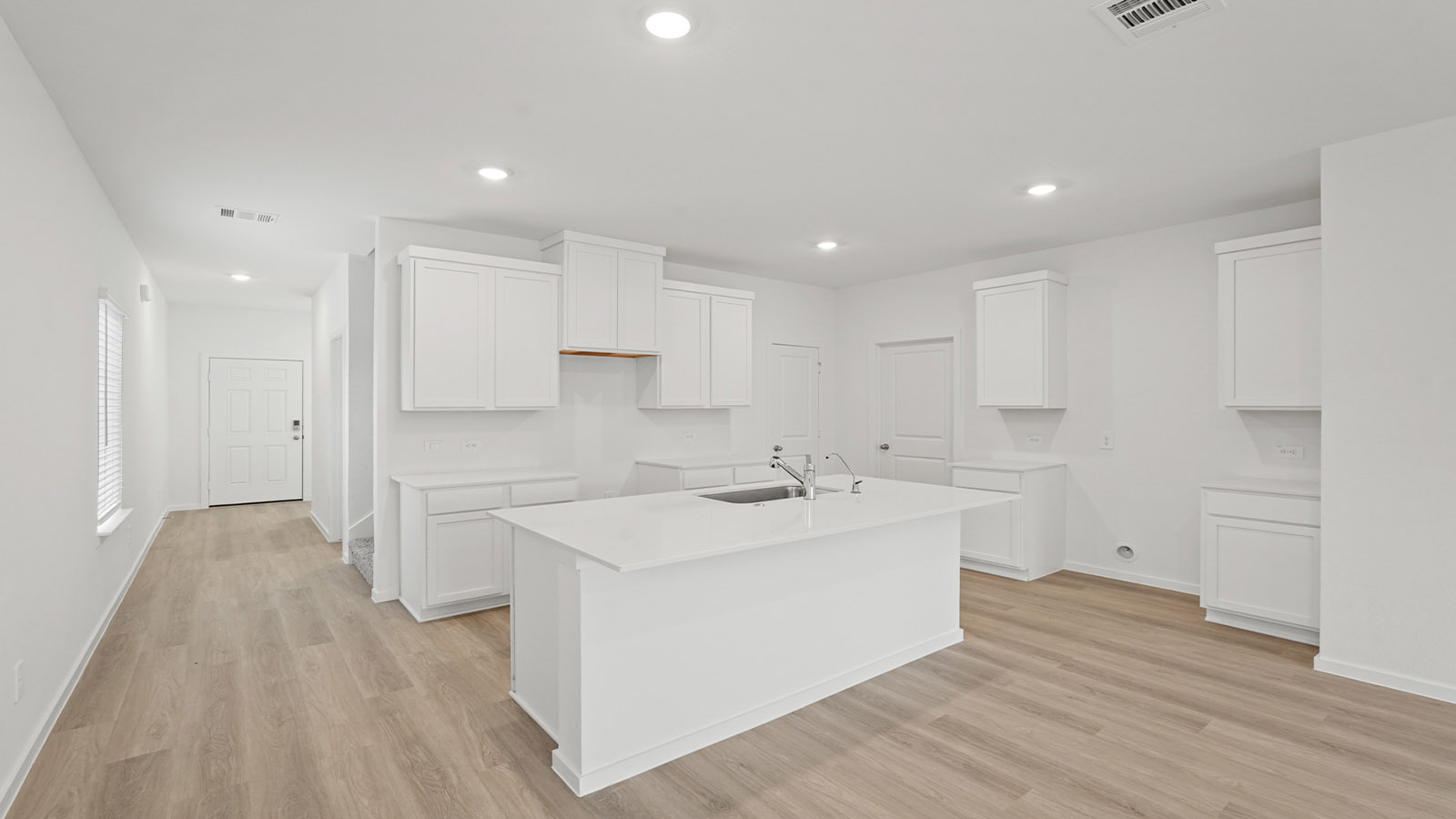 Open concept living, dining, and kitchen area