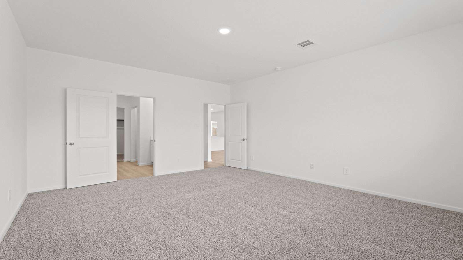 Primary bedroom with bright windows