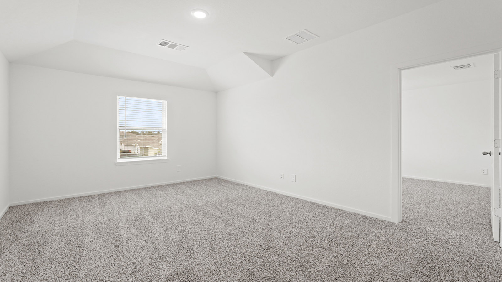 Second story game room with carpet flooring