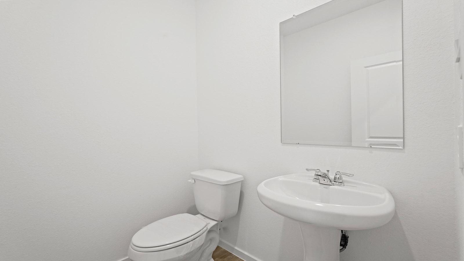 Powder bathroom with pedestal sink