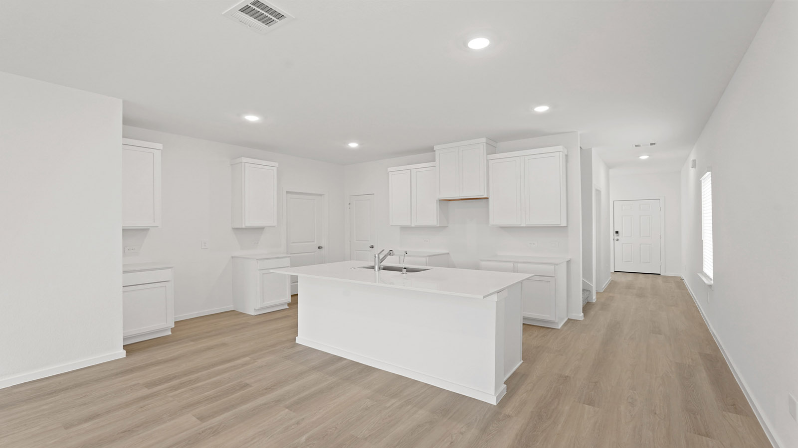 Open concept living, dining, and kitchen area