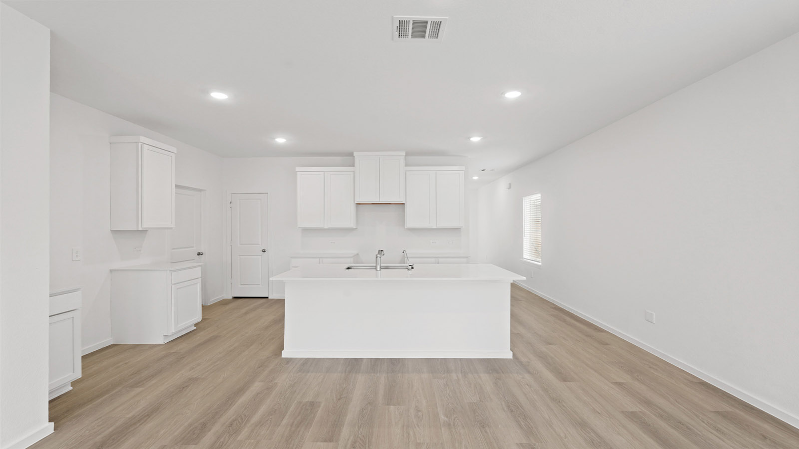 Open concept living, dining, and kitchen area