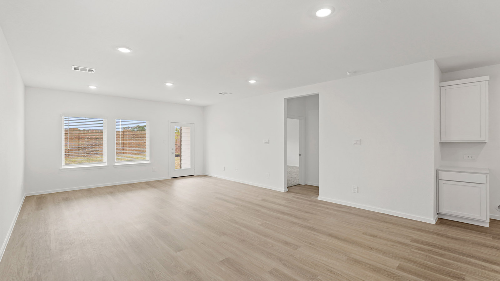 Open concept living, dining, and kitchen area