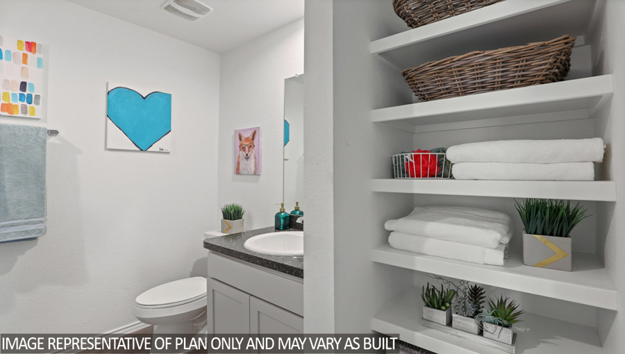 Secondary bathroom with vinyl flooring and a linen nook.