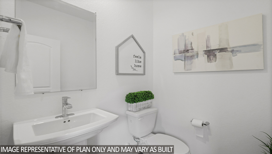 Powder room with a pedestal sink and vinyl flooring.