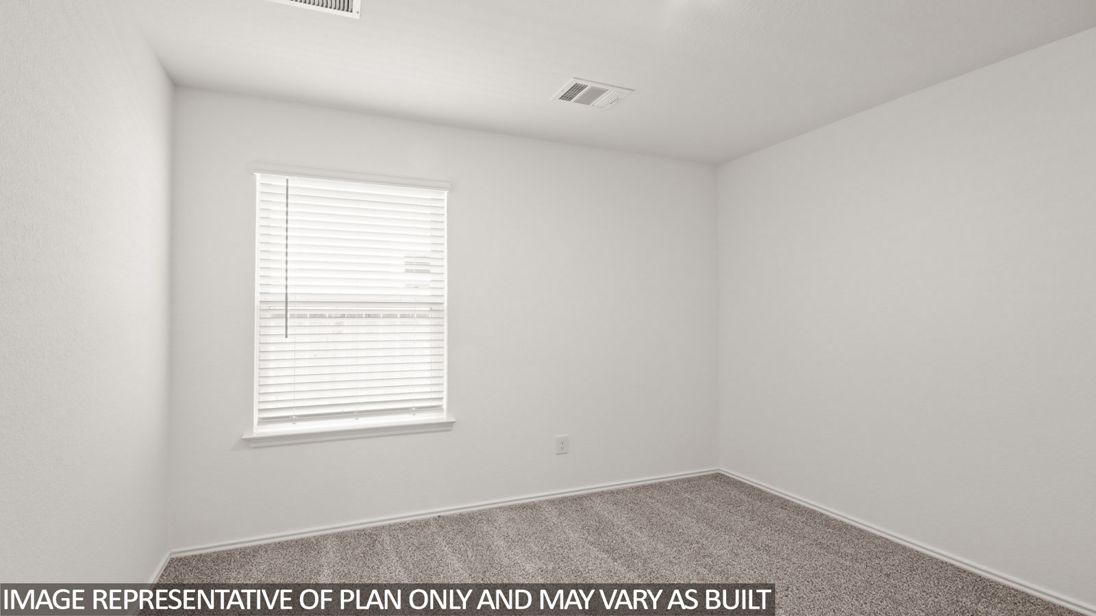Secondary bedroom with carpet flooring