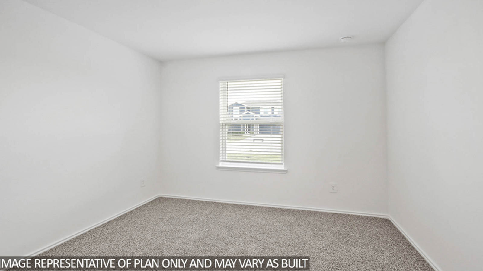 Secondary bedroom with carpet flooring and a bright window.